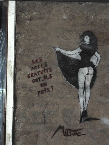 Paris street art by Miss Tic graces a wall near Rue Mouffetard.