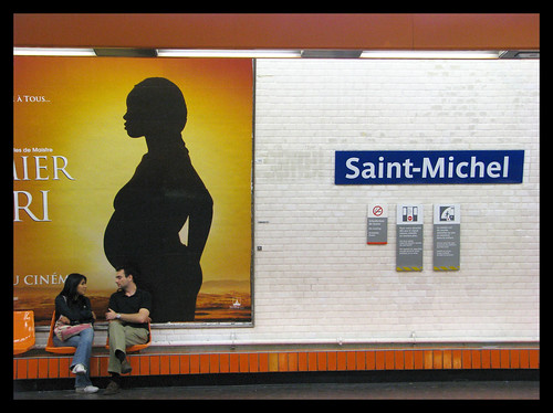 Waiting for a train at the Saint-Michel Metro station