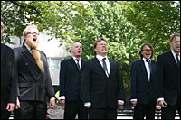 The Finnish group Mieskuoro Huutajat, or Shouting Men, performs in Washington, D.C.'s Dupont Circle neighborhood. [Photo by Jenny Gold/NPR] 