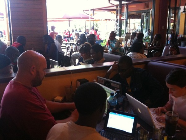 Six members of Ushahidi’s Kenyan team working in an “ad hoc situation room” – ak.a. a coffee shop in Nairobi (via @ushahidi on Twitter)
