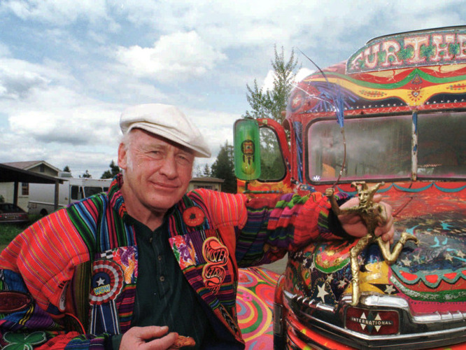 Author Ken Kesey poses in 1997 with his bus, "Further," a descendant of the vehicle that carried Kesey and the Merry Pranksters on the 1964 trip immortalized in Tom Wolfe's book The Electric Kool-Aid Acid Test. Kesey, who died in 2001, is the subject of the new documentary Magic Trip. [Source: Jeff Barnard/AP/NPR]